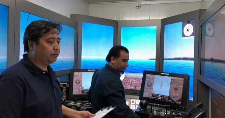 two marine personnel using simulation tools for DPO certificate Refresher training