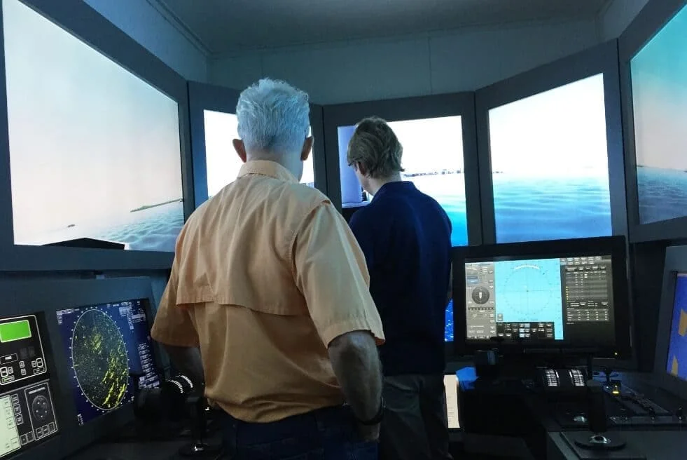 A trainee taking SEA Maritimes Services' DP Simulator Course with a trained professional.